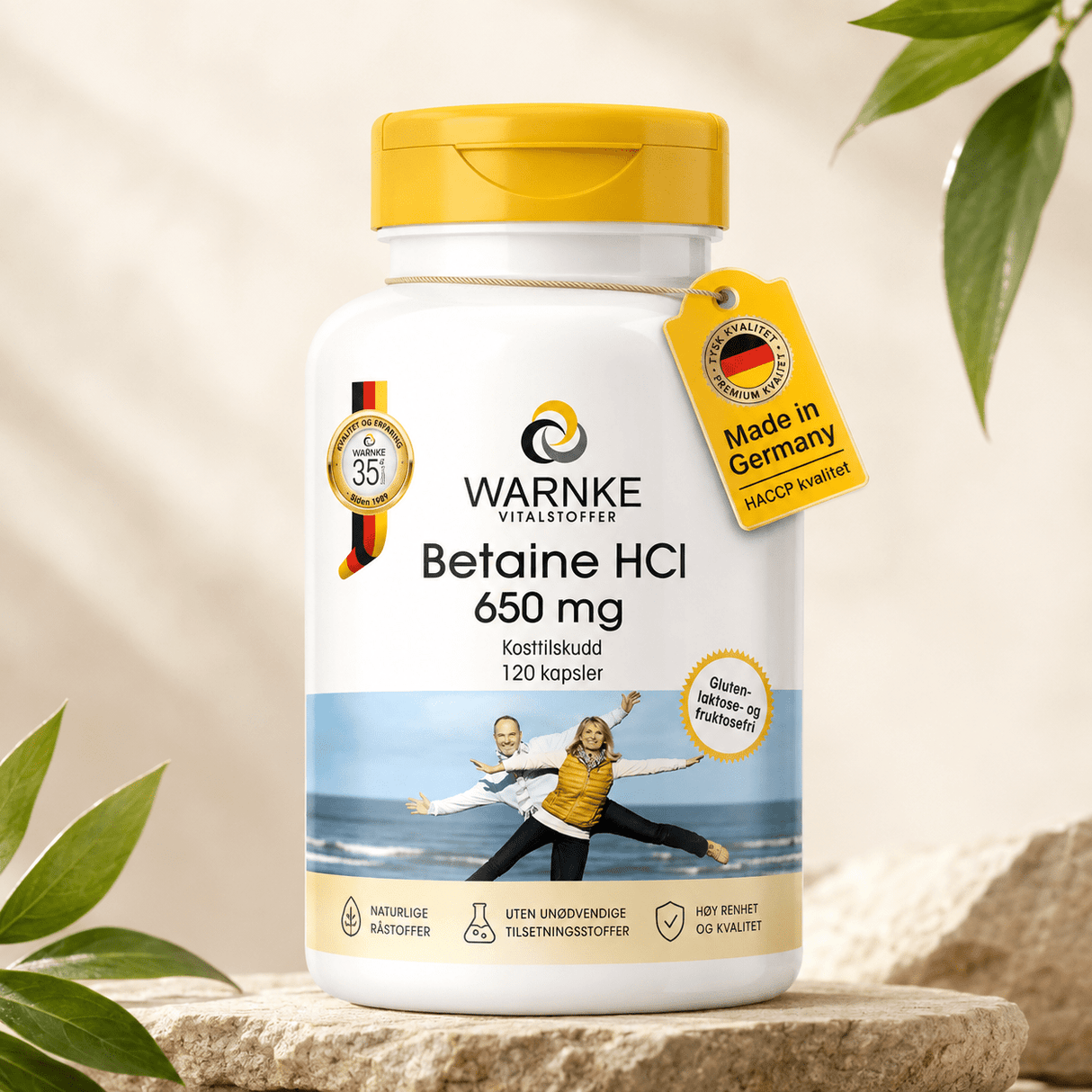 Capsule di betaina HCl da 650 mg in un contenitore bianco con tappo giallo, etichetta con dettagli del prodotto e origine.