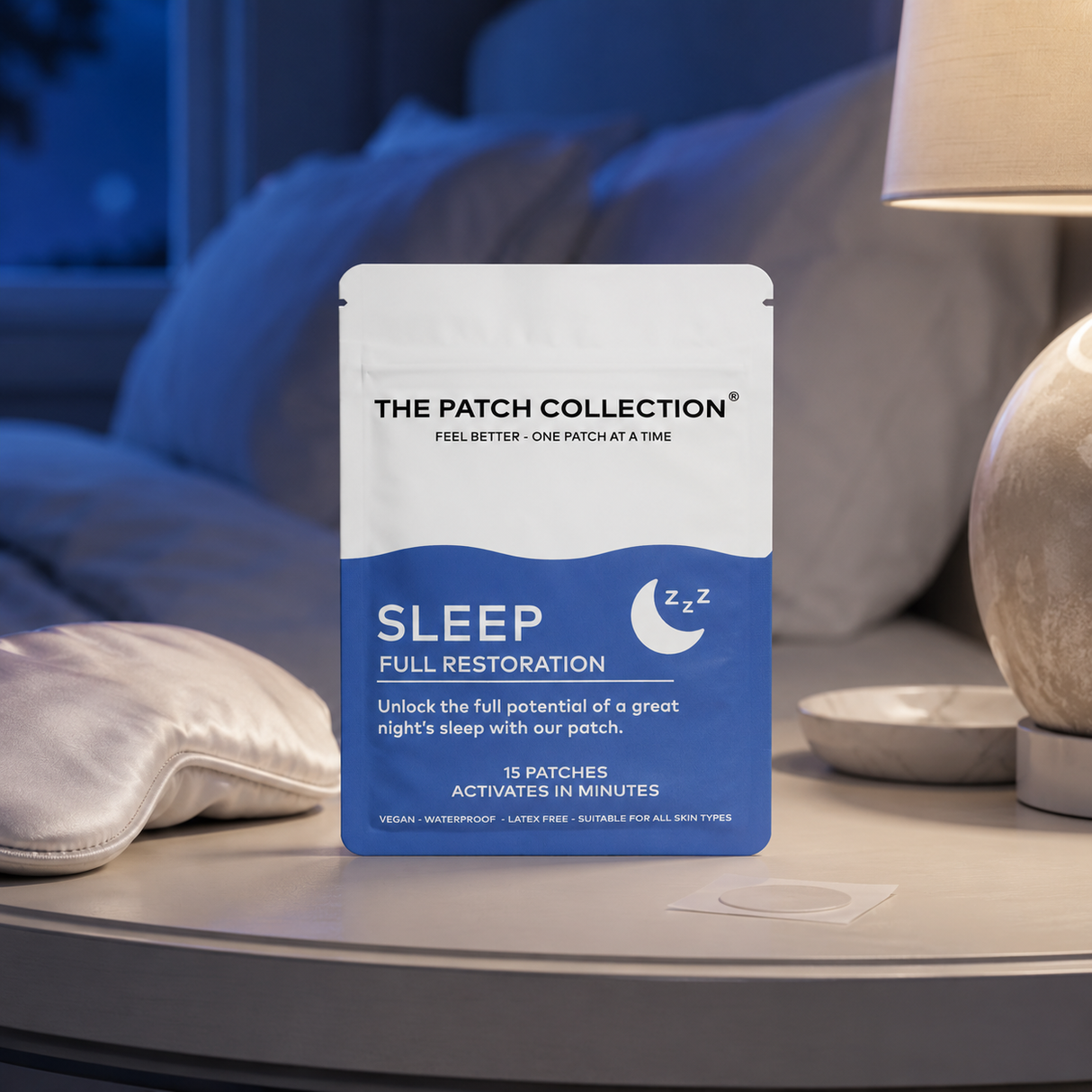 Pack of 15 evening patches from The Patch Collection, color design with blue and white, placed on a bedside table.