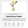 Golden drop hanging from a pipette, on a light background, symbols for vegan and dermatological testing.