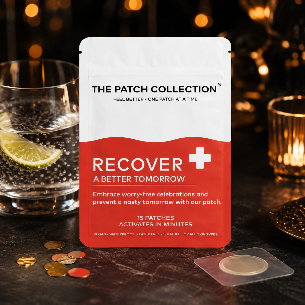 Compact pack of 15 Recover Patches, red and white design, placed by a glass of lime and coin.