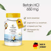 Betaina HCl 650 mg capsule in una scatola bianca e gialla con 120 capsule, contrassegnata con "Made in Germany".