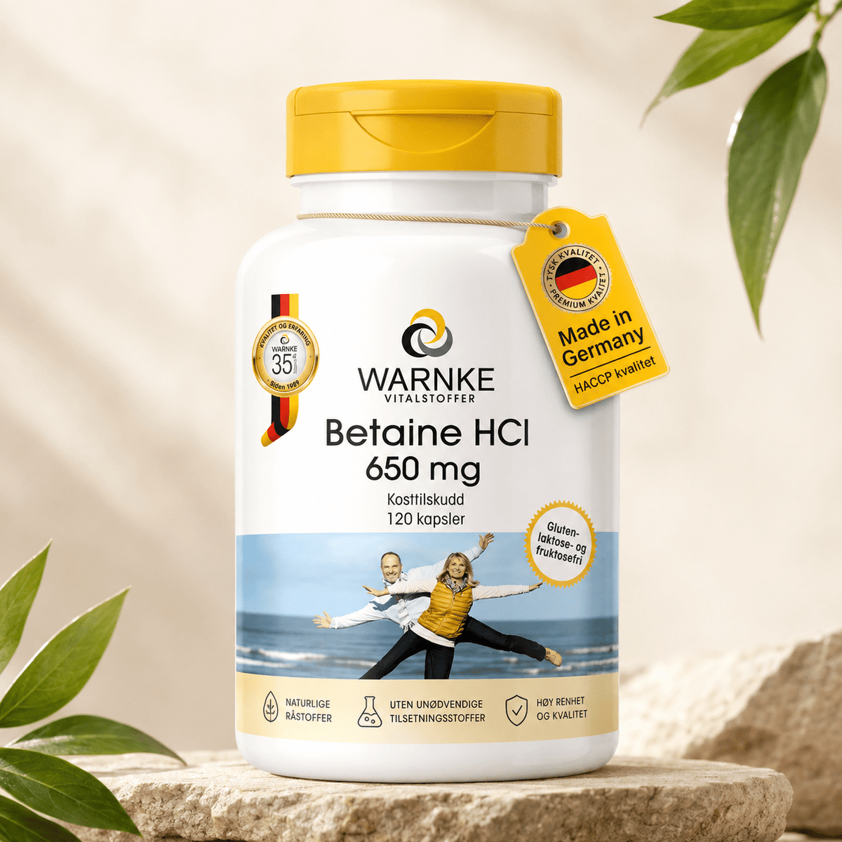 Capsule di betaina HCl da 650 mg in un contenitore bianco con tappo giallo, etichetta con dettagli del prodotto e origine.