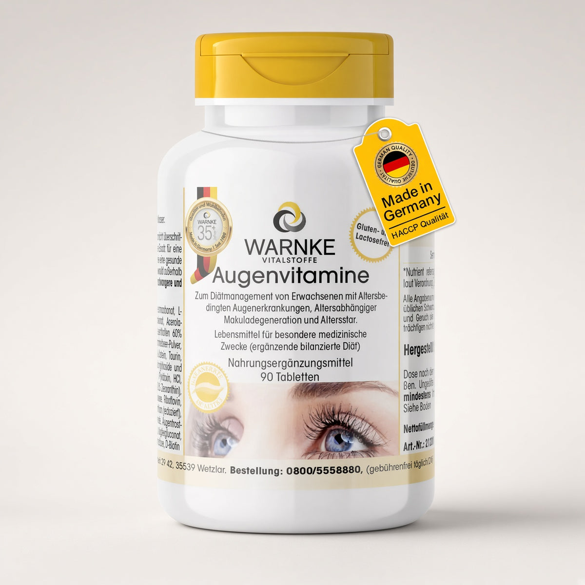 Øjenvitaminer fra Warnke, hvid flaske med gult låg, indeholder 90 tabletter. Etiketten beskriver indholdet og brugsanvisningen.