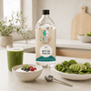 Go-Keto MCT Oil Pure C8 bottle of 1000 ml with smoothies, yogurt and salad in a bright kitchen environment.