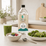 Go-Keto MCT Oil Pure C8 bottle of 1000 ml with smoothies, yogurt and salad in a bright kitchen environment.
