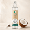 Huile GoKeto MCT dans une bouteille en verre de 500 ml, avec une étiquette indiquant « Pure C8 » et un produit végétalien. Noix de coco fraîche à part.