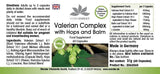 Valerian Complex with hops and lemon balm, 60 vegan capsules. Green label with herbs and capsules illustrated.