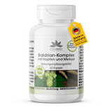 Valerian Complex with hops and lemon balm, white plastic container with 60 vegan capsules and green design.